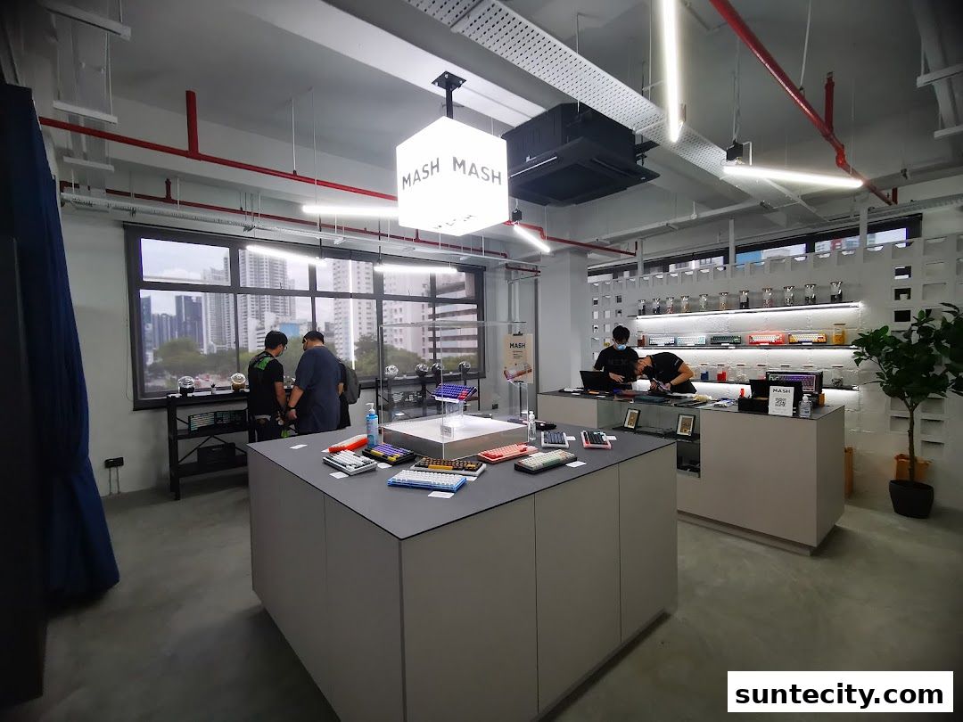 Interior of a modern retail store showcasing custom keyboards and computer peripherals.
