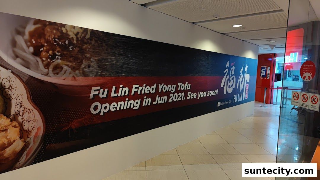 A large banner announcing the upcoming opening of Fu Lin Fried Yong Tofu.