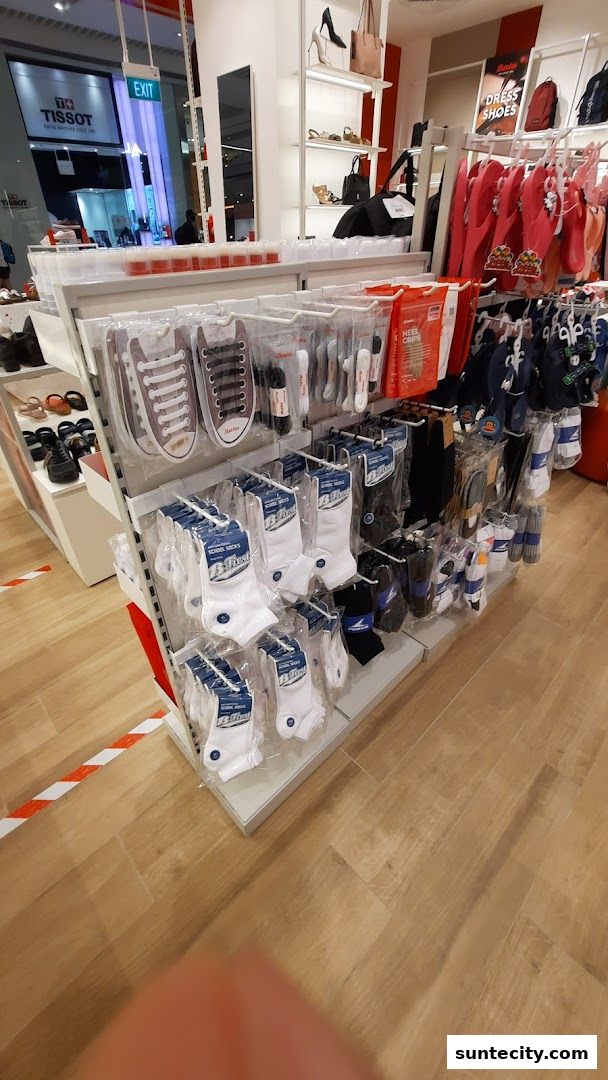A display of socks and shoe accessories in a Bata store.