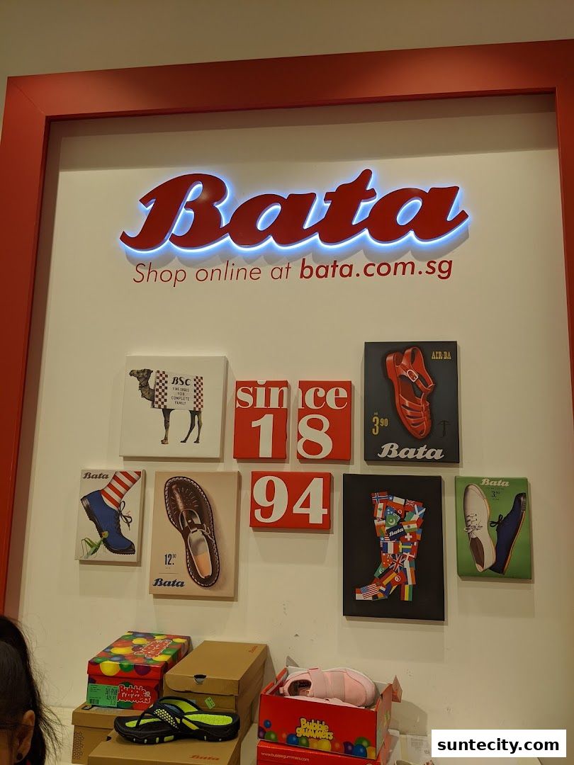 Bata store interior with shoes, boxes, and decorative wall art.