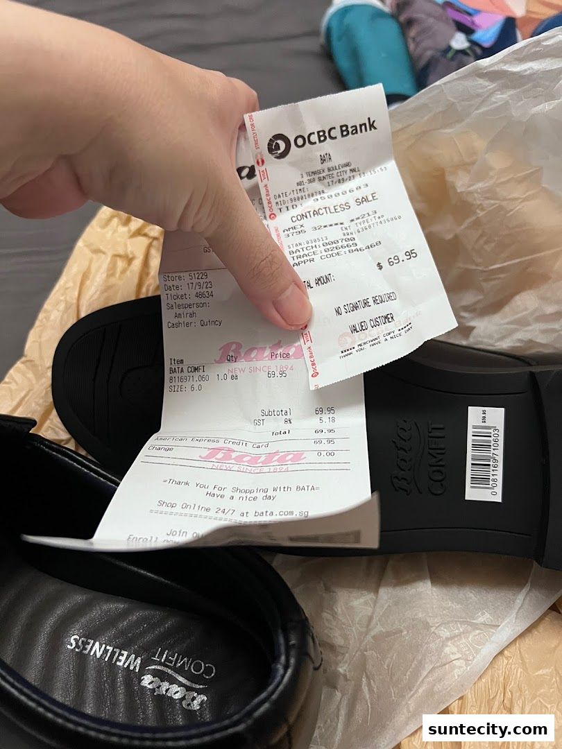 A receipt and a pair of Bata Comfit shoes are shown, with a hand holding the receipt.