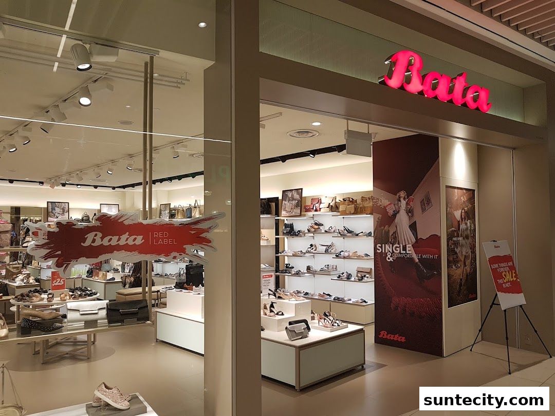 The entrance of a Bata shoe store showcasing various footwear and bags.