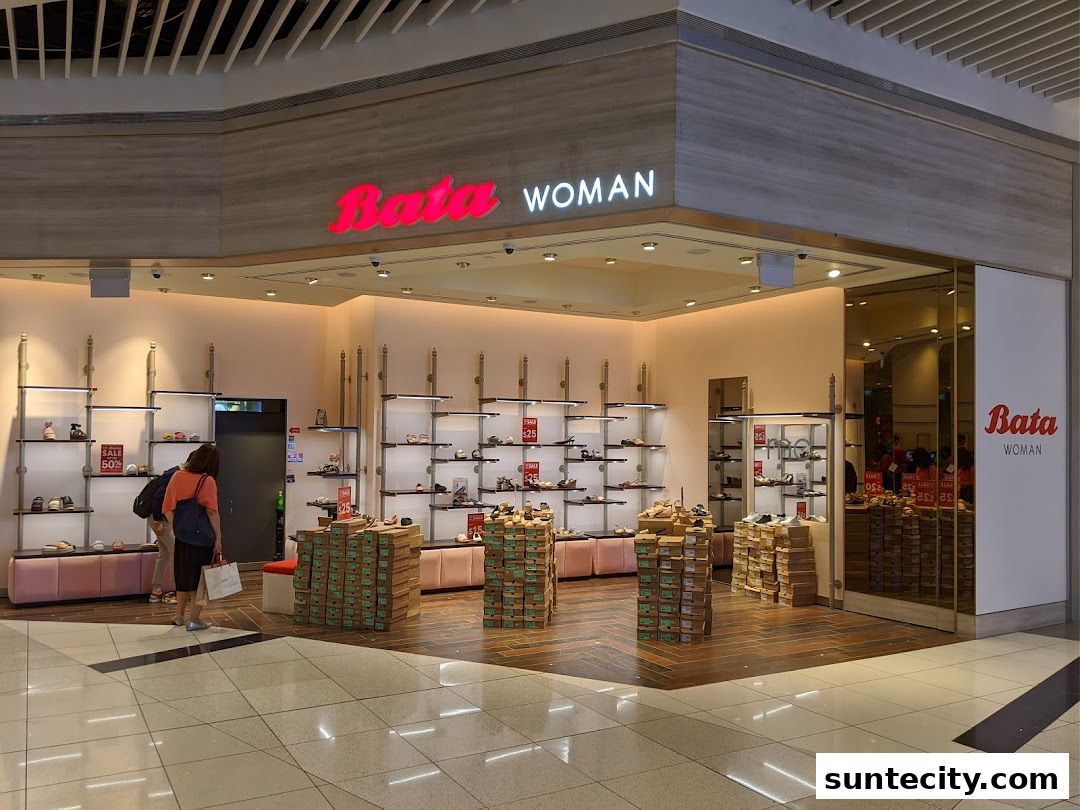 The Bata Woman shoe store features a well-lit interior with shelves displaying various footwear and stacks of shoe boxes.