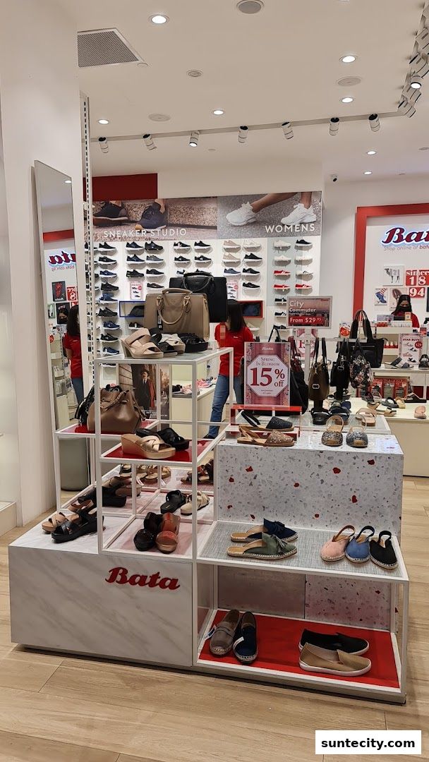 Interior view of a Bata shoe store showcasing various women's footwear and handbags.