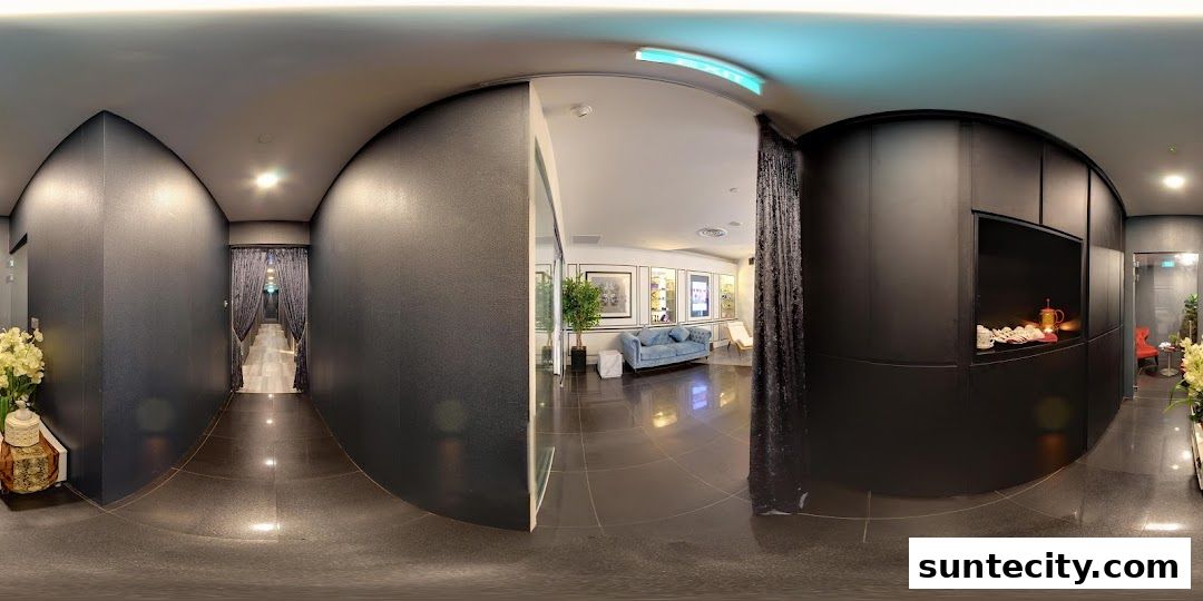 Interior view of a spa or salon with a waiting area and treatment rooms.