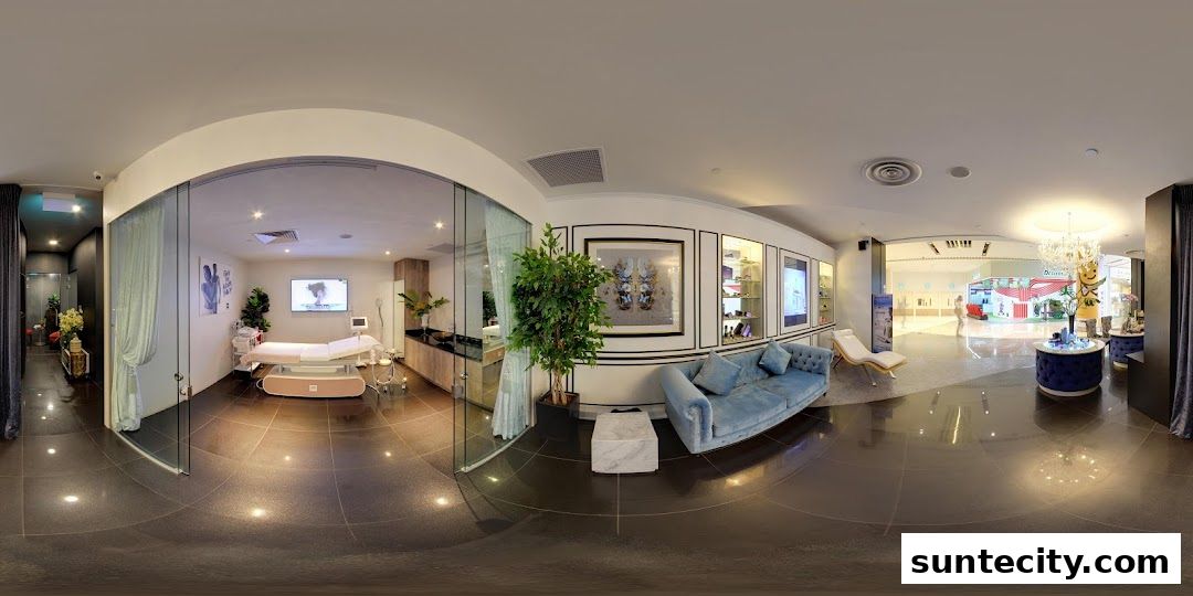 Interior view of a modern beauty salon with treatment beds, seating, and displays.