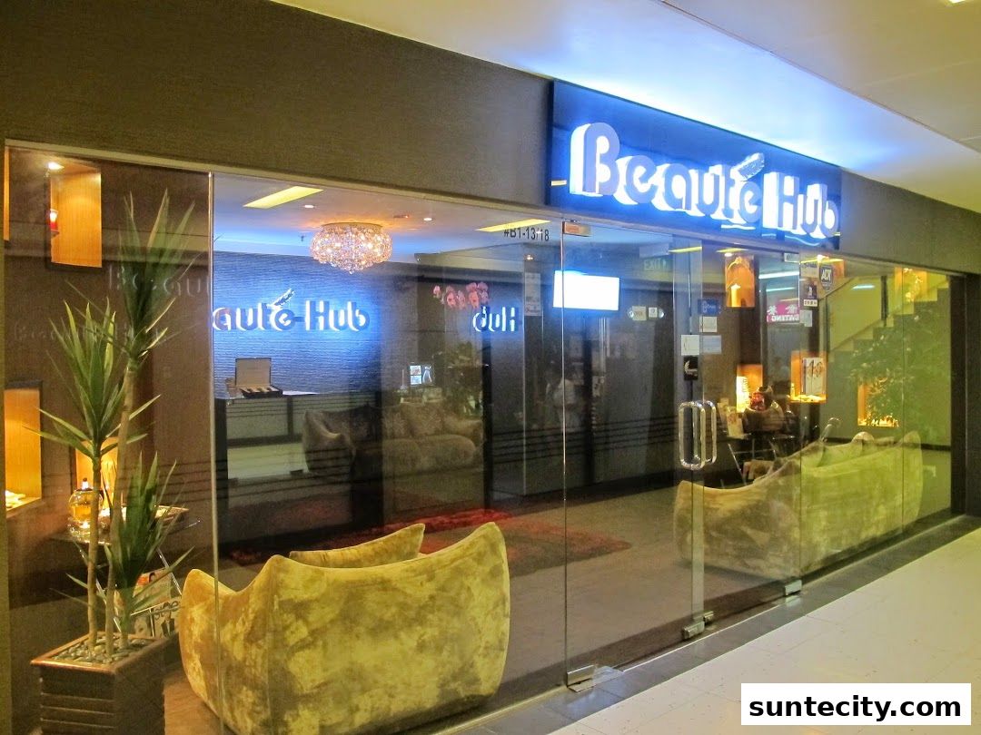The entrance of Beauté Hub, a beauty salon, with a modern and luxurious interior visible.