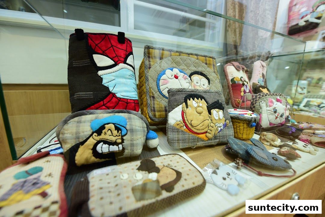 A display case filled with handmade pouches and accessories featuring popular cartoon characters.
