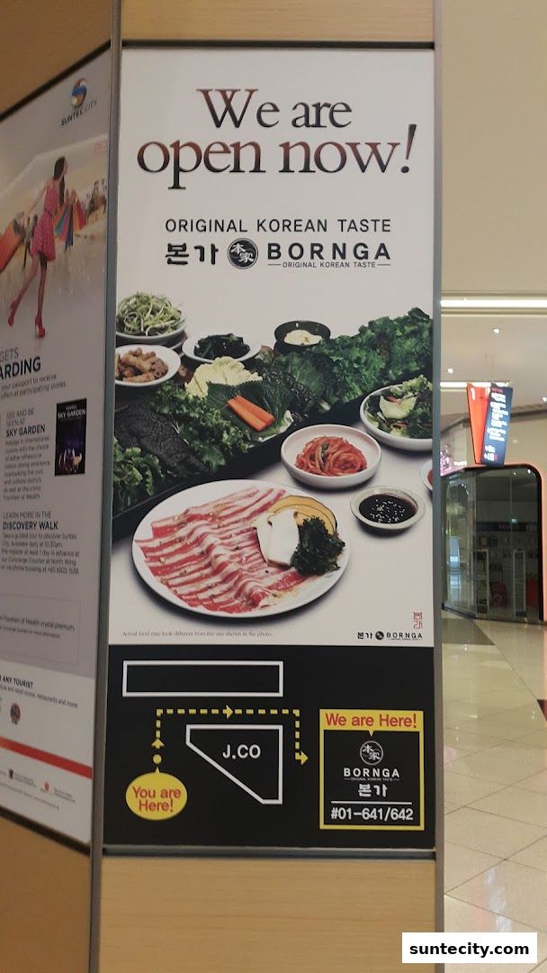 A sign announcing Bornga restaurant is open, featuring Korean food and directions within Suntec City.