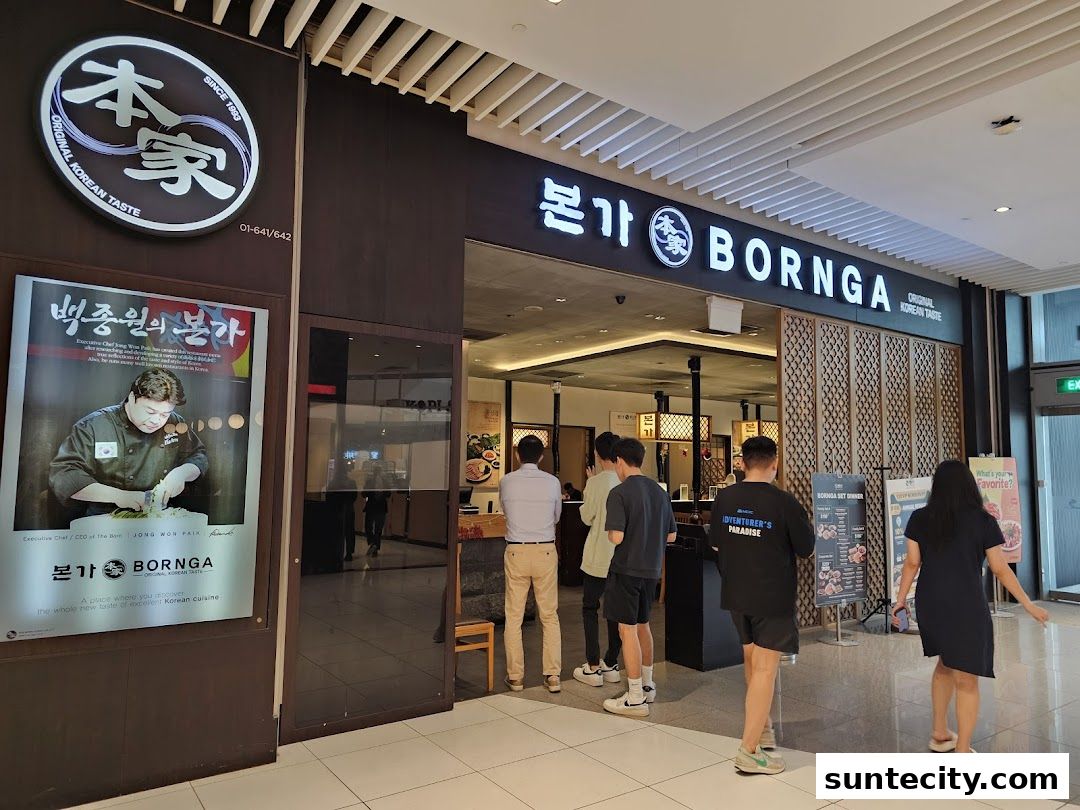 The entrance of Bornga, a Korean restaurant, with customers queuing and a promotional poster.