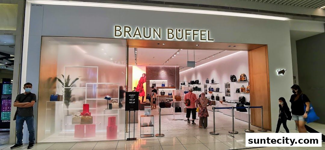 The Braun Büffel Suntec City store entrance showcases stylish handbags and accessories with a modern, clean aesthetic.