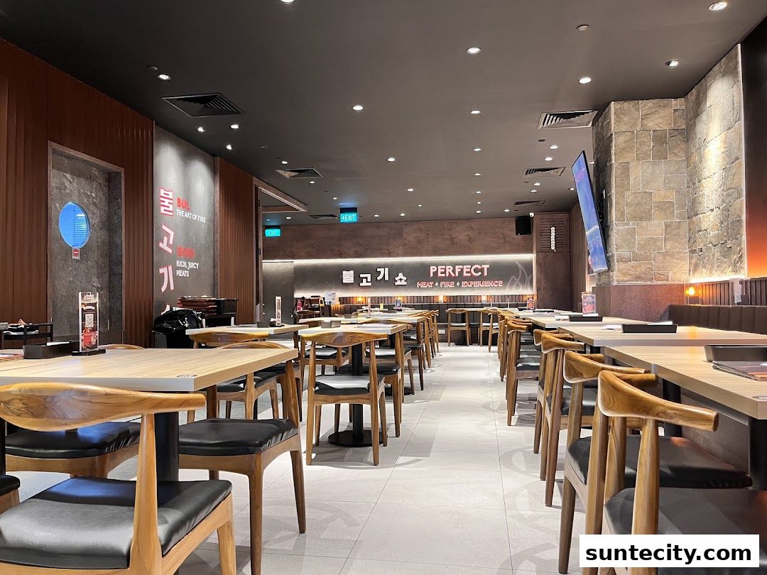 Interior view of a Korean BBQ restaurant with tables and chairs set up.
