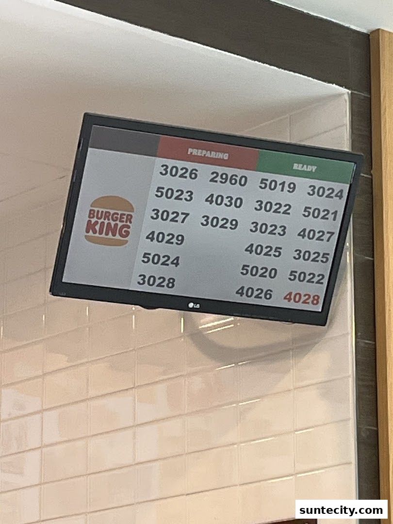 Burger King order status screen showing preparing and ready order numbers.