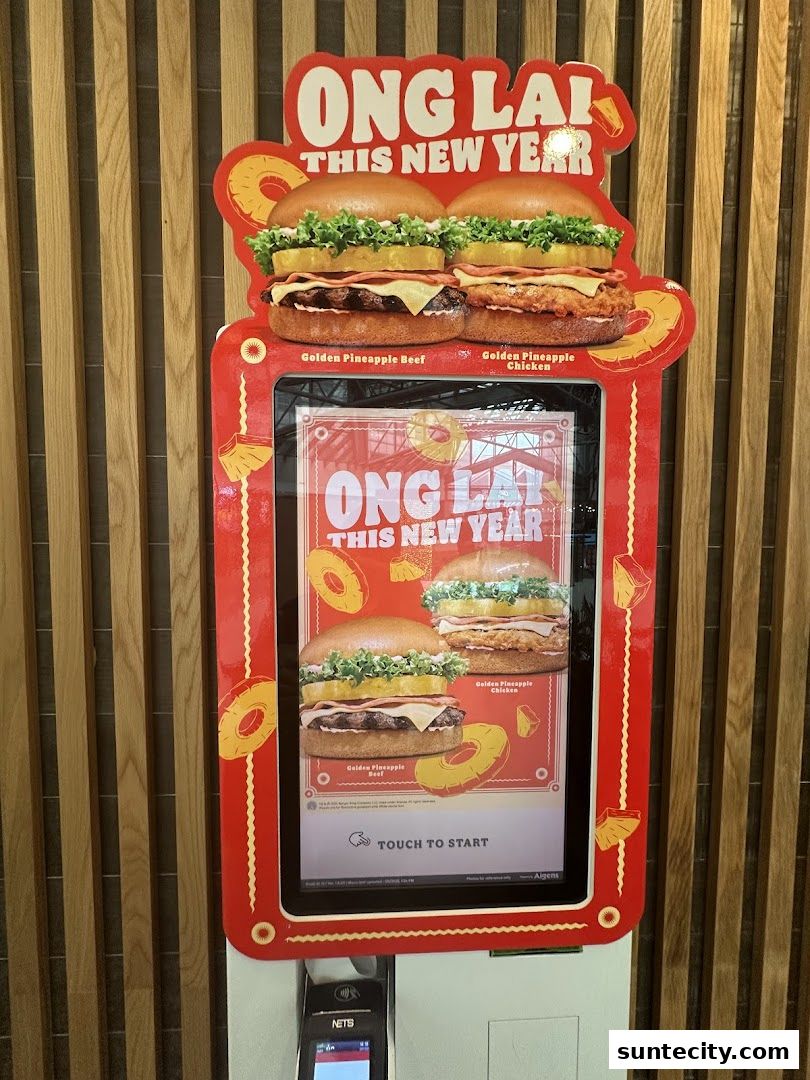 A Burger King promotional display featuring two new pineapple-themed burgers for the New Year.