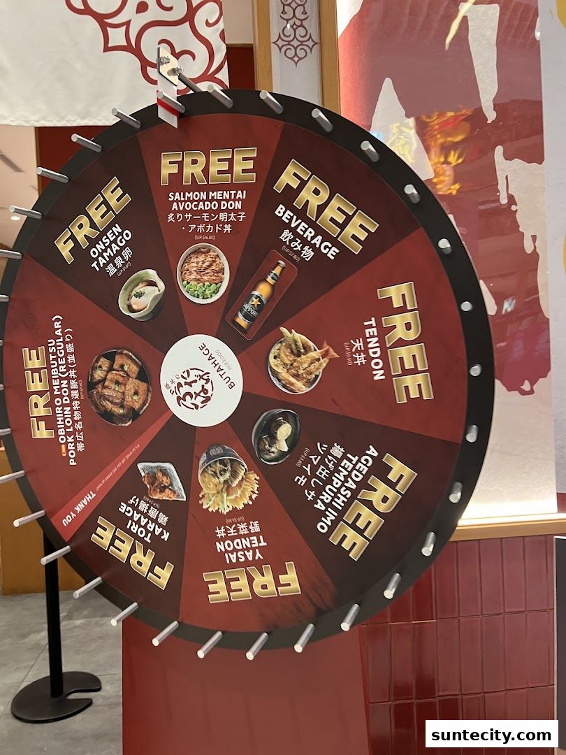 A spinning wheel with various free food and beverage prizes from Butahage.