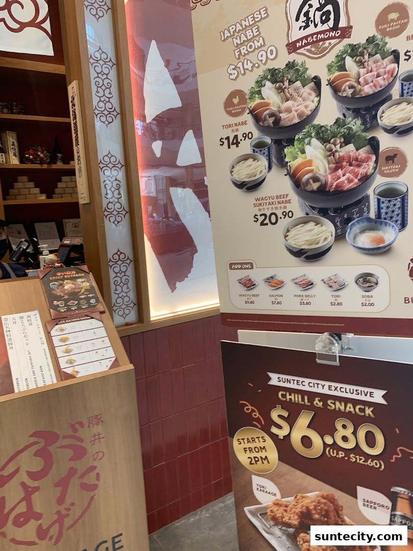A display of Japanese nabe dishes and a chill and snack promotion.