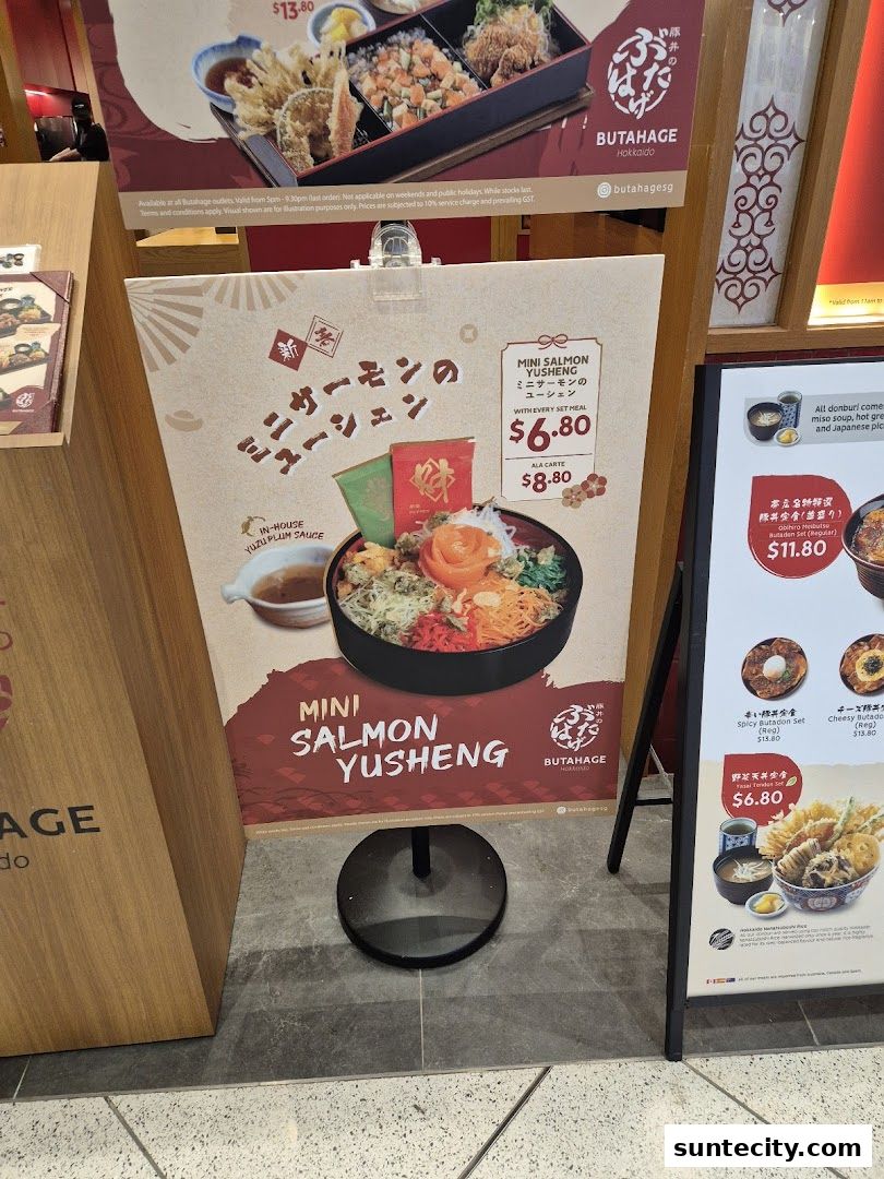 A promotional poster for Butahage's Mini Salmon Yusheng dish with prices and ingredients.