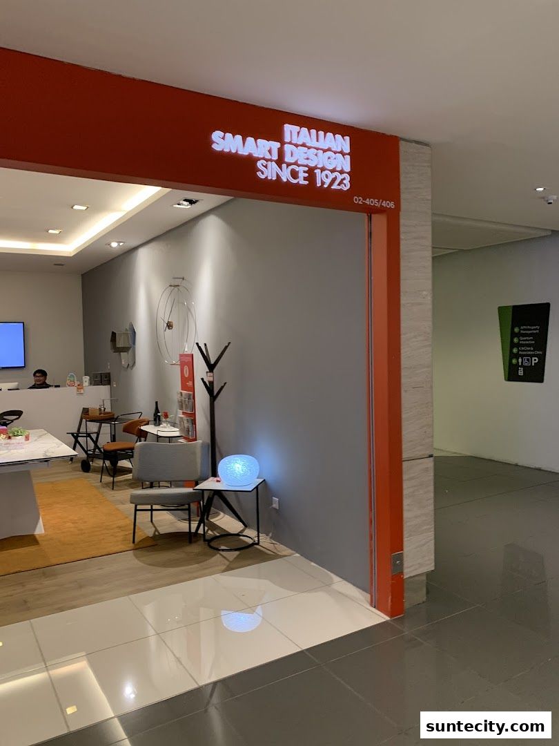 Entrance to a luxury Italian furniture store with modern seating and decor.