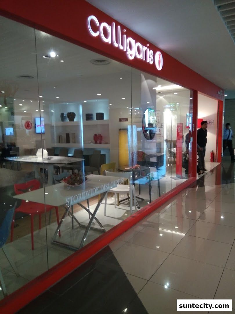 Exterior view of a Calligaris furniture store with modern Italian designs and storewide discounts.