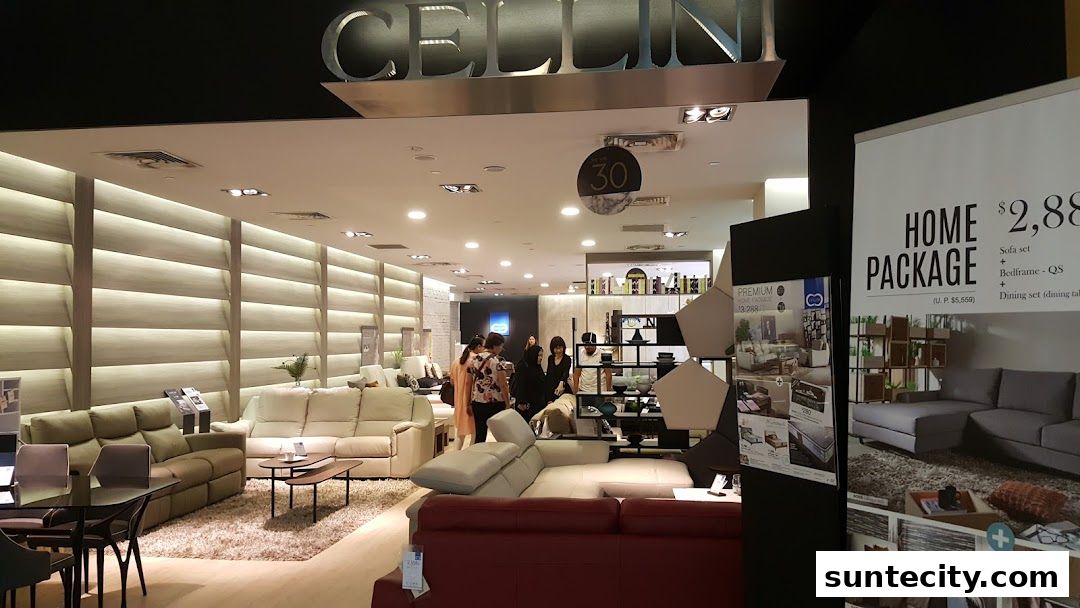 Interior view of a modern furniture store showcasing sofas and dining sets.