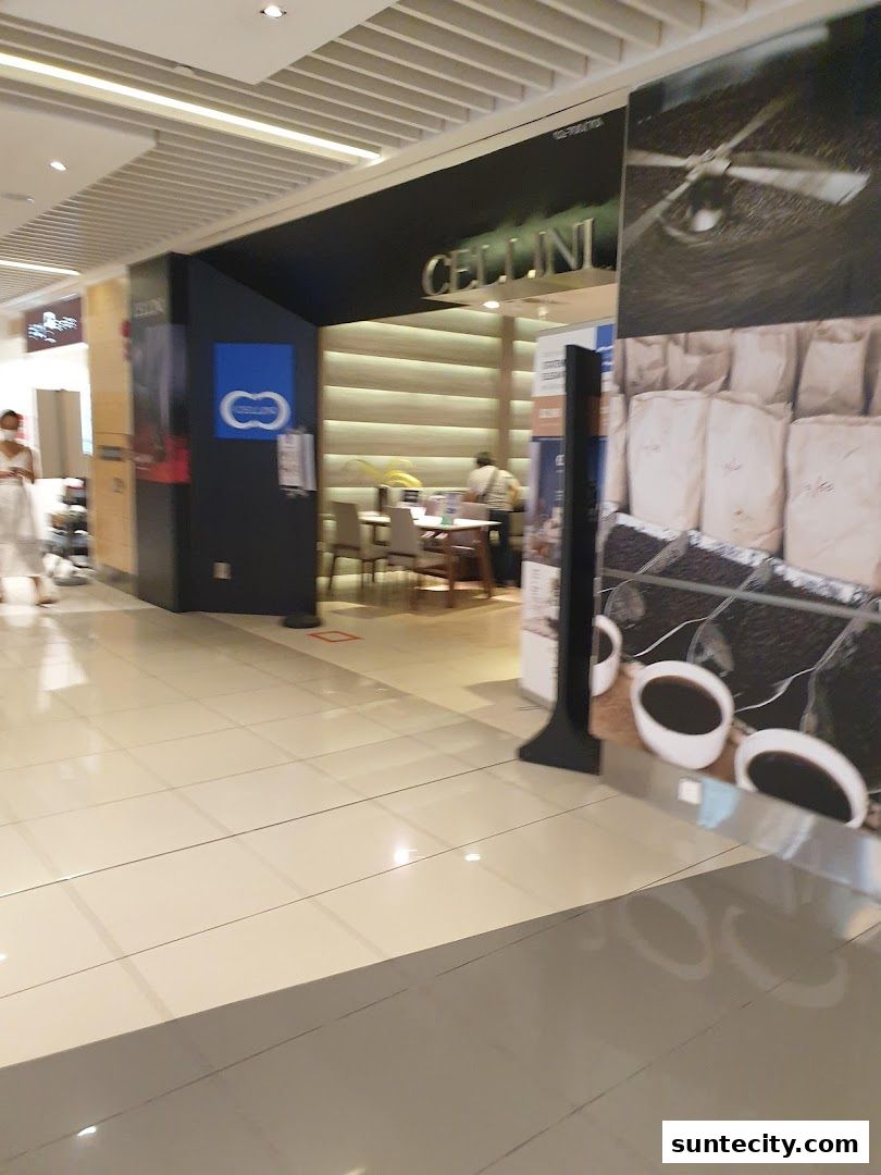 The entrance to Cellini, a shop with a modern interior and a large graphic display.