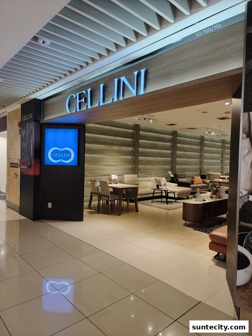 The entrance to Cellini, a furniture store, showcasing stylish living room and dining room sets.