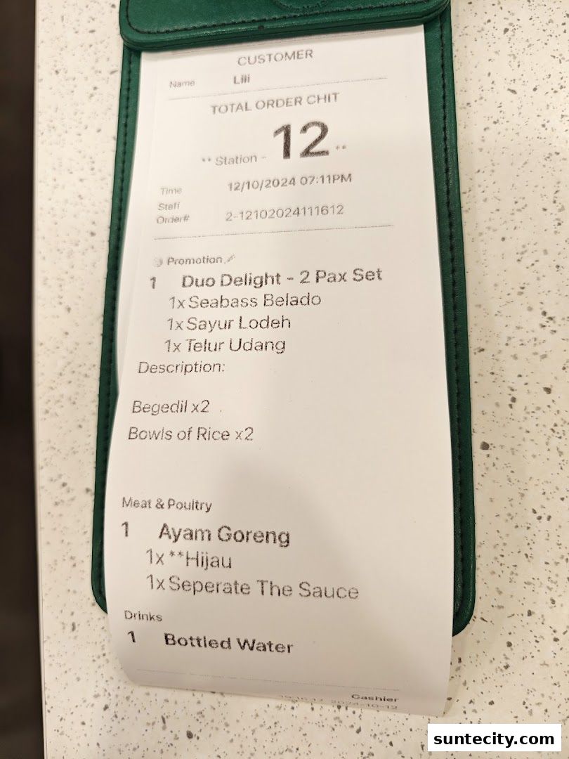A receipt from Chopstix Indonesian Restaurant showing a Duo Delight set and Ayam Goreng.