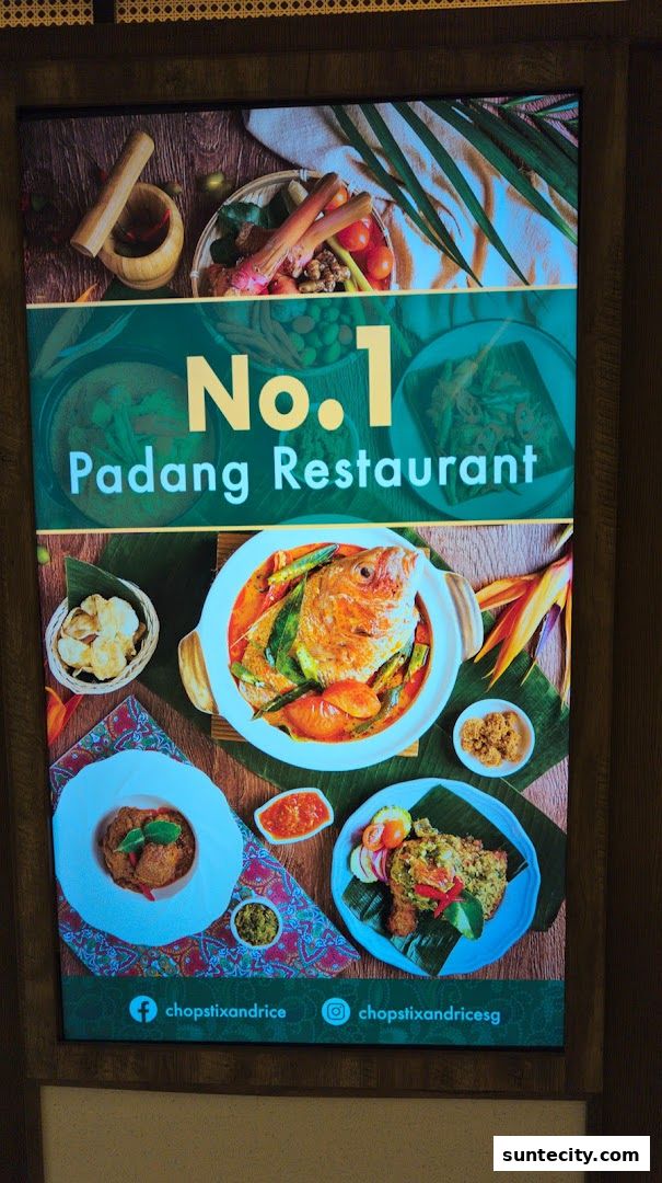 A vibrant display showcasing delicious Indonesian Padang cuisine, highlighting a whole fish dish and other flavorful meals.