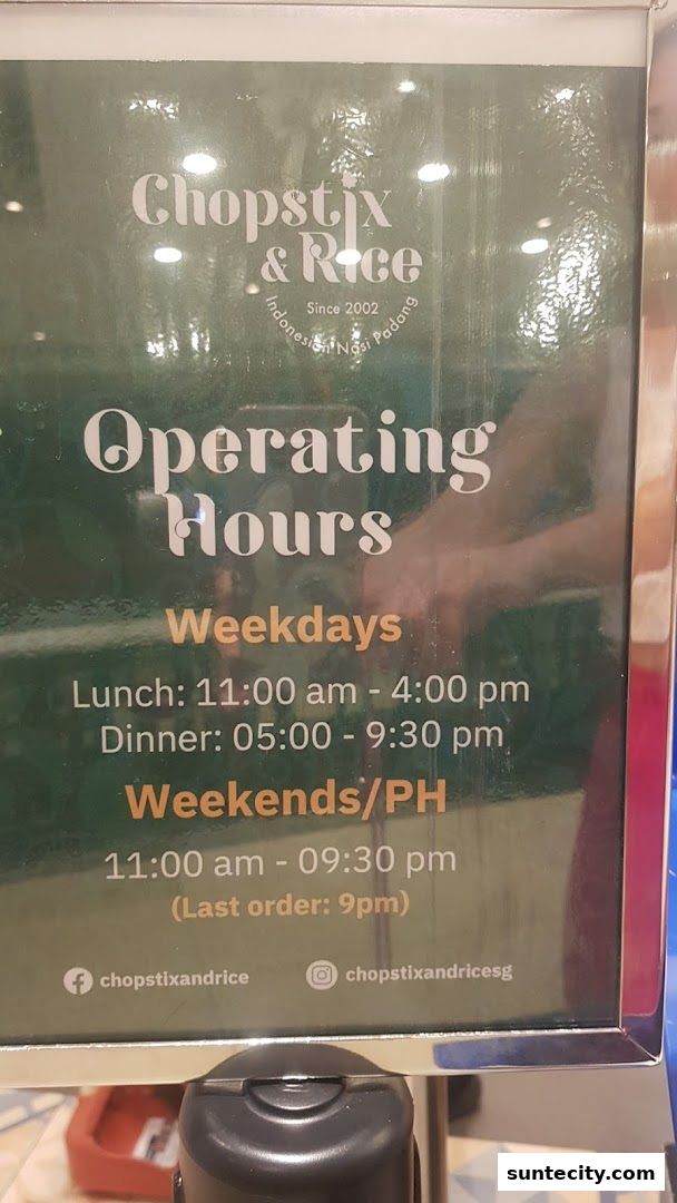 Operating hours sign for Chopstix & Rice Indonesian Nasi Padang restaurant.
