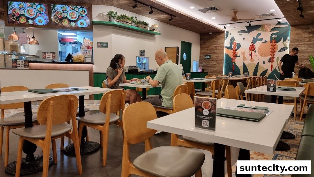 Interior of a modern Indonesian restaurant with diners and decorative wall art.