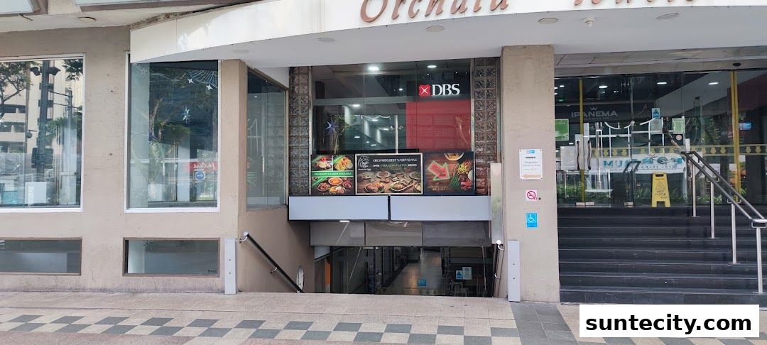 The entrance to Chopstix Rice Indonesian Restaurant, featuring food displays and the DBS bank logo.