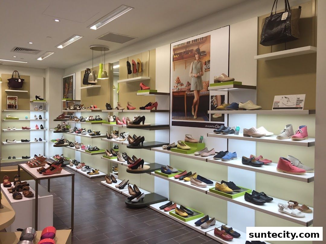 Interior view of a Clarks shoe store showcasing a wide variety of footwear for men, women, and children.