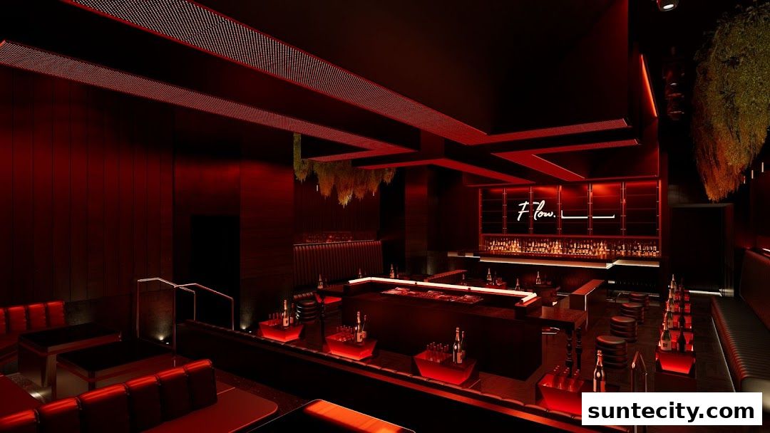 Interior of a modern nightclub with red lighting, a bar, and seating areas.