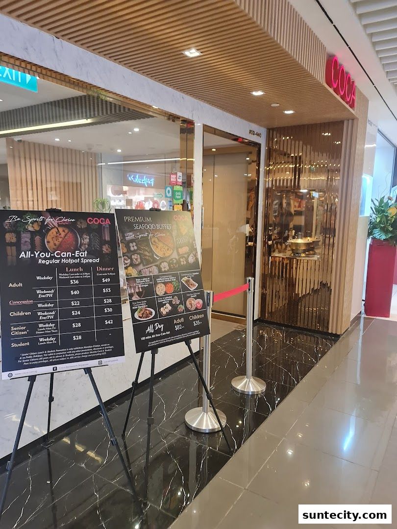Two display boards advertising all-you-can-eat hotpot and seafood buffet outside a restaurant.