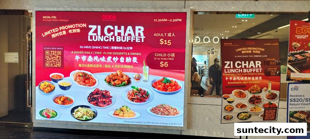 A digital display advertises a Zi Char Lunch Buffet at COCA, featuring various dishes and pricing.