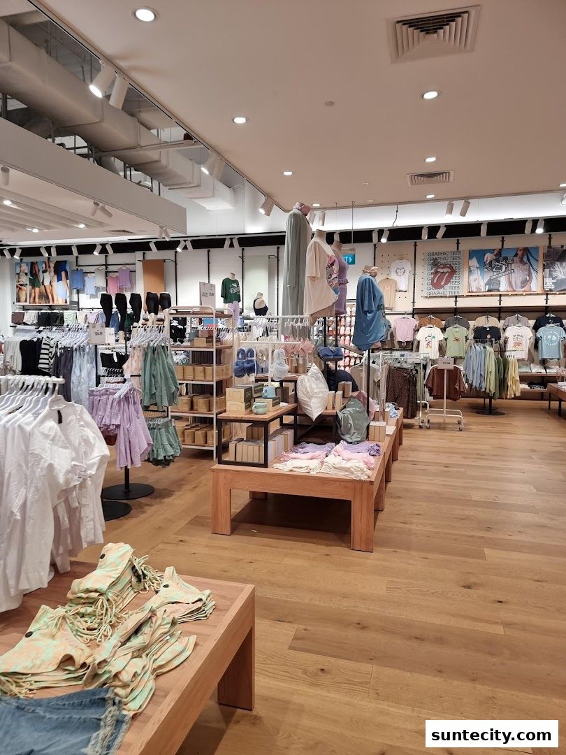 Interior view of a Cotton On store showcasing clothing displays and mannequins.