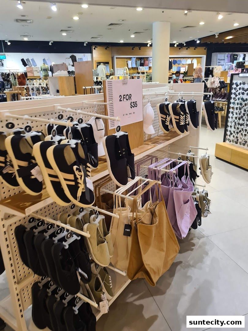 A display of footwear and bags at Cotton On, featuring a '2 for $35' promotion.