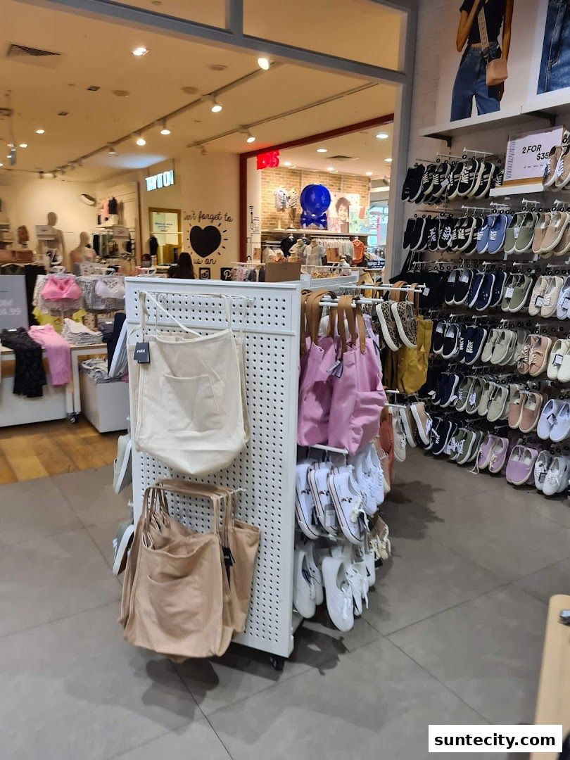 Interior view of a Cotton On store showcasing apparel and footwear displays.