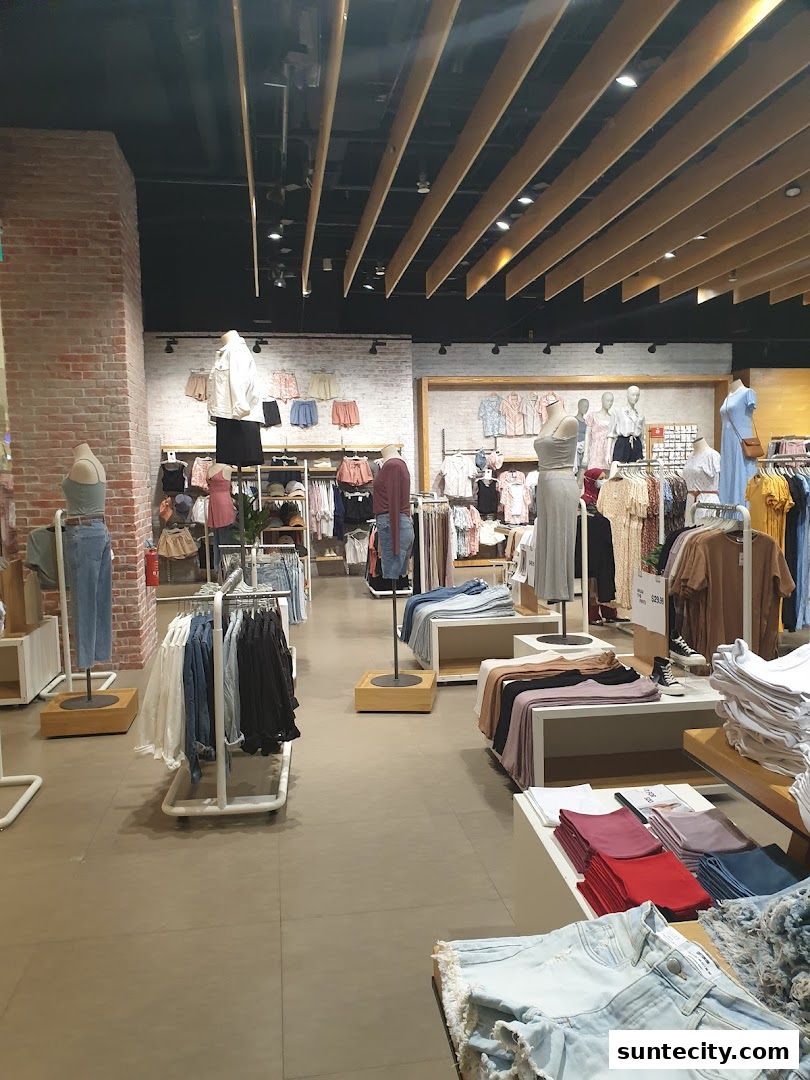 Interior view of a Cotton On store showcasing a variety of casual clothing and accessories.