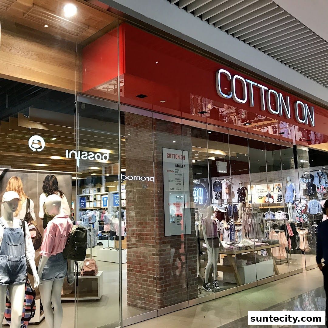 The Cotton On shop front displays mannequins in trendy outfits and a wide selection of clothing inside.