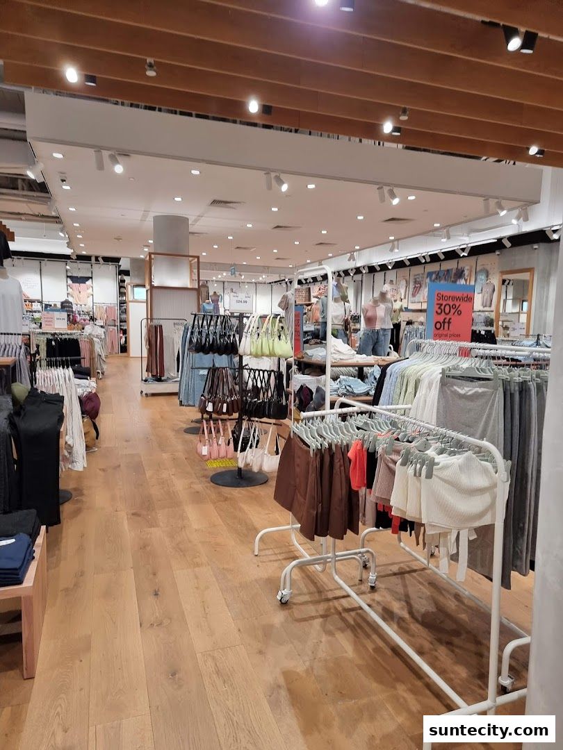 Interior view of a Cotton On store showcasing clothing racks with various apparel and accessories.