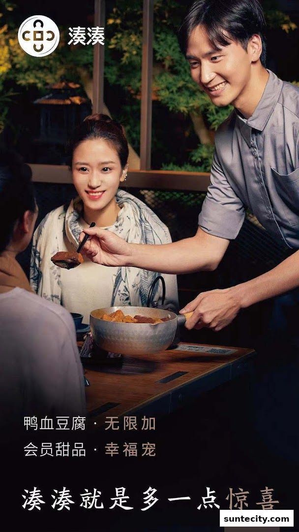 A server serves hotpot to happy diners at Coucou HotpotBrew Tea.