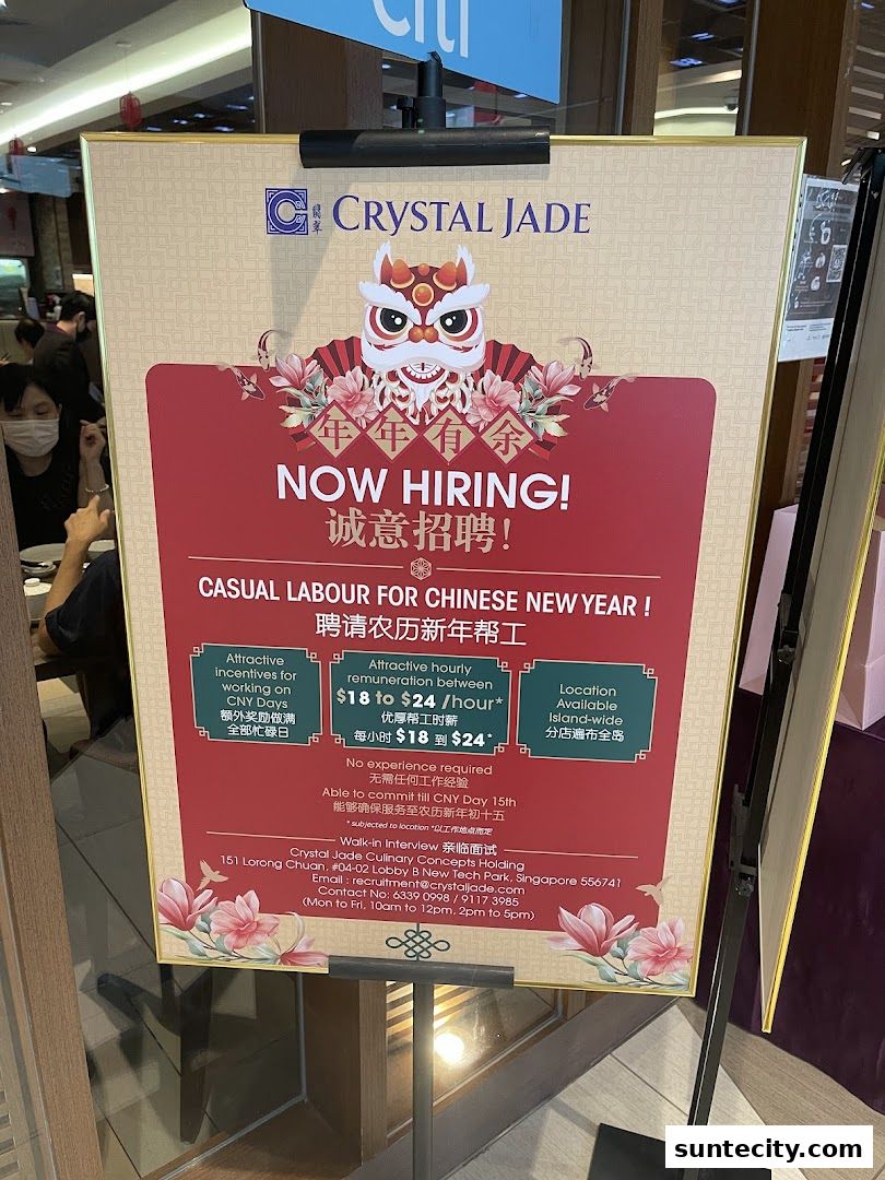 A 'Now Hiring' sign for Crystal Jade Hong Kong Kitchen, advertising casual labor for Chinese New Year.