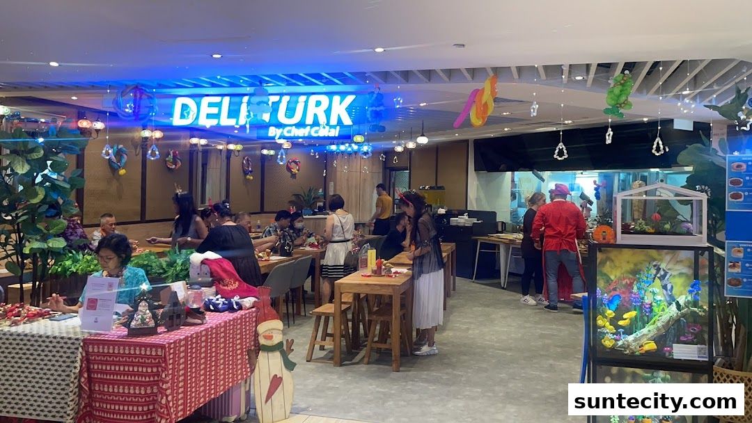 Interior view of Deli Turk by Chef Celal with diners and festive decorations.