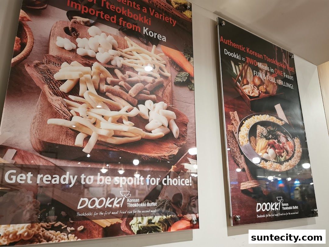 Two posters showcasing Dookki Korean Tteokbokki Buffet with various ingredients and dishes.