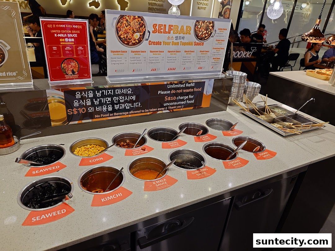 A display of various sauces and ingredients for making topokki at Dookki.