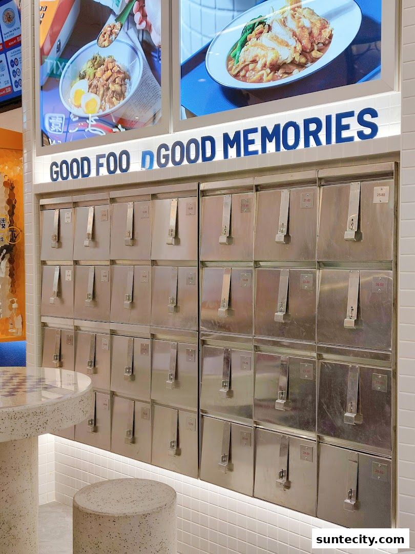 A shop interior with food images and rows of metal lockers, featuring the name 'GOOD FOOD GOOD MEMORIES'.