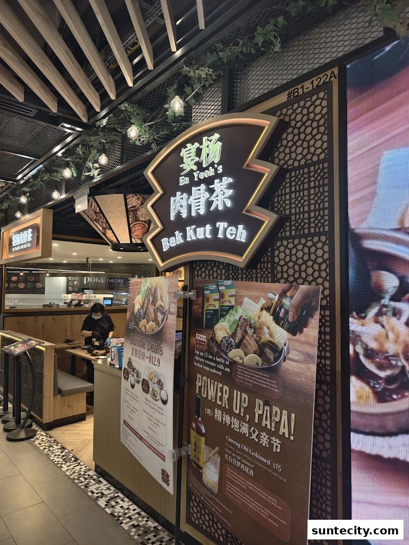 En Yeoh's Bak Kut Teh shop front with promotional posters and signage.