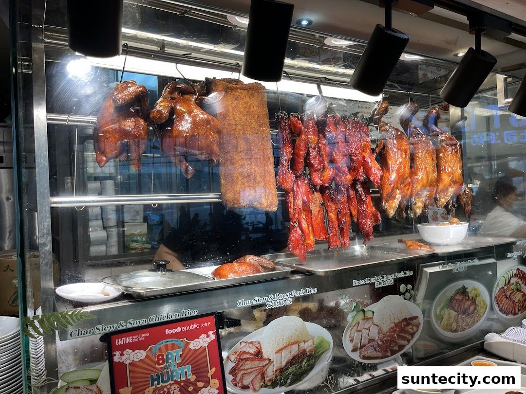 A display of roasted meats including duck, char siu, and roast pork at Food Republic.