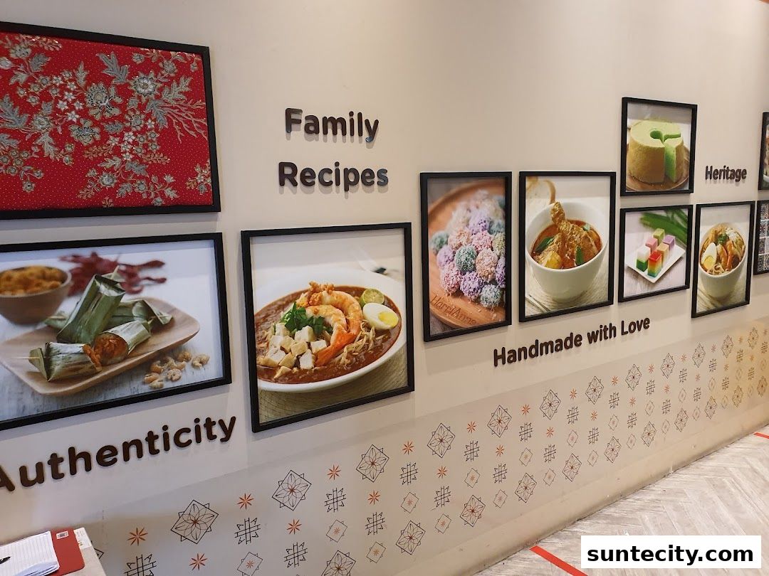 Wall display featuring framed photos of various dishes and decorative elements.